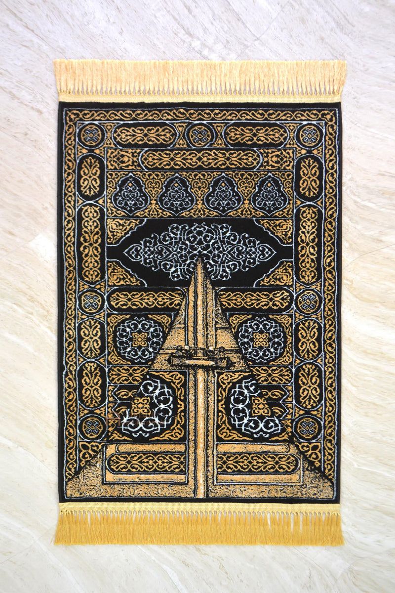 The door of the Kaaba prayer mat